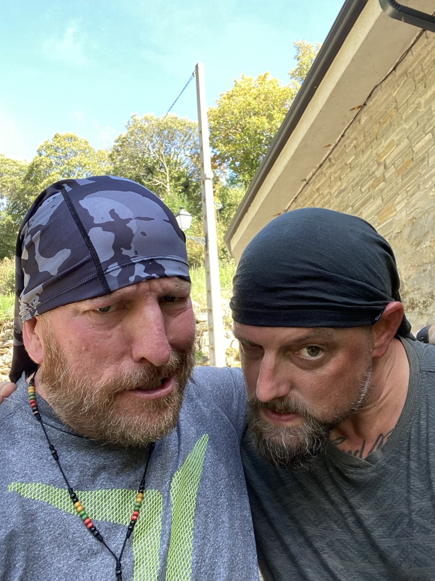 Two pilgrims in bandanas pulling faces for the camera