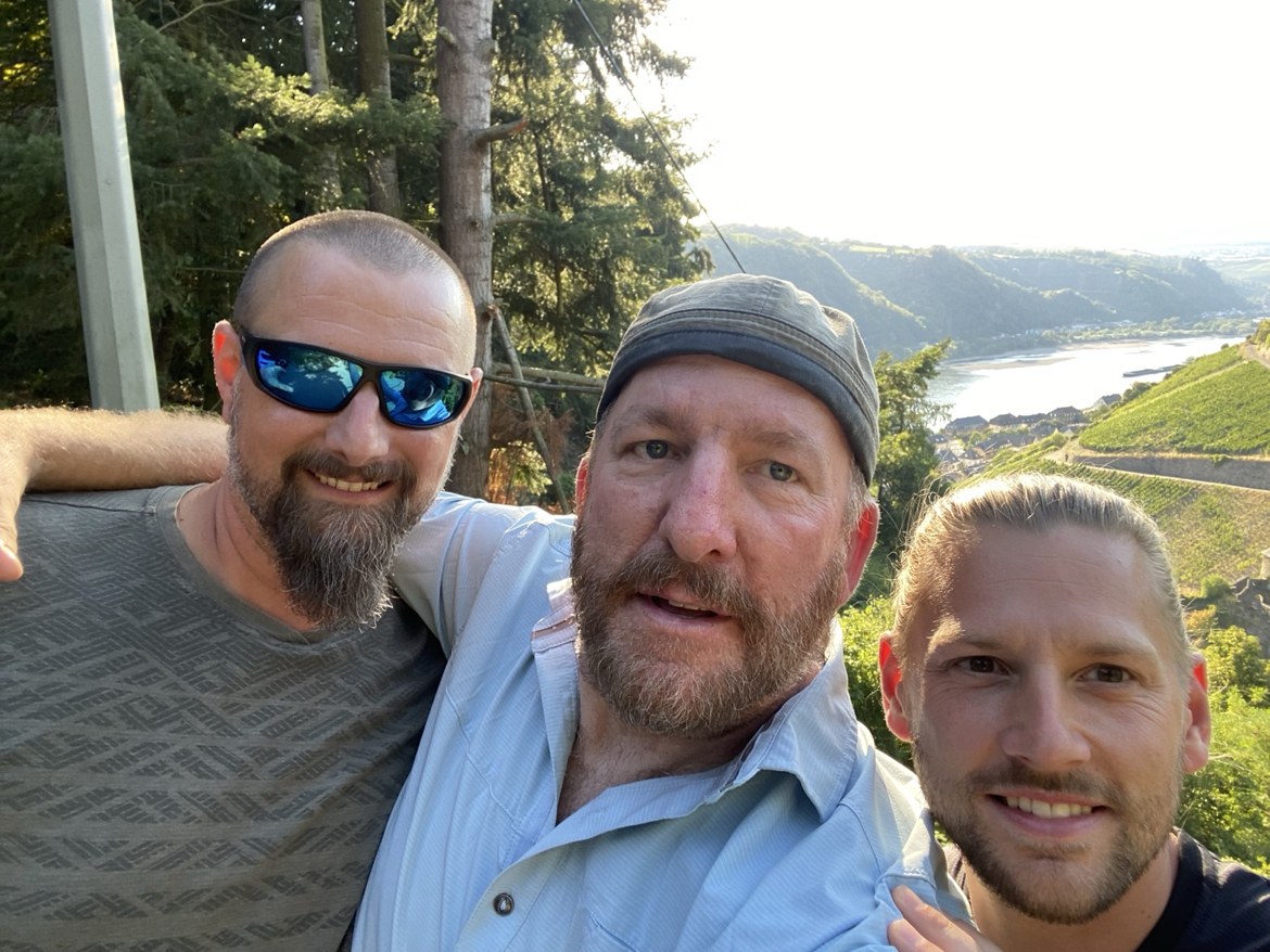 Nicki, Mike and Dennis taking a selfie above the Rhine vineyards