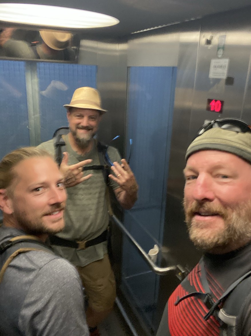 Dennis, Nicki and Mike taking a selfie in a hotel elevator