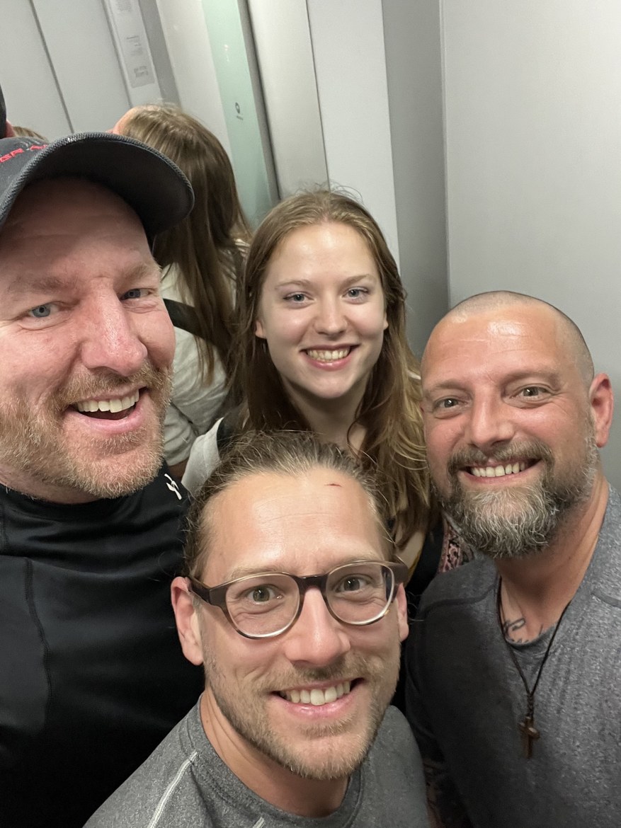 Mike and his daughter Sarah smiling together in a lift in Porto