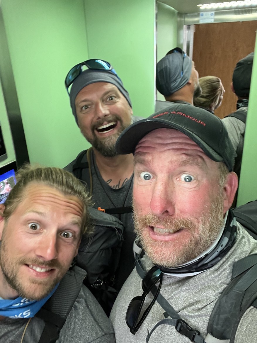 The three brothers in the same lift, pulling different faces