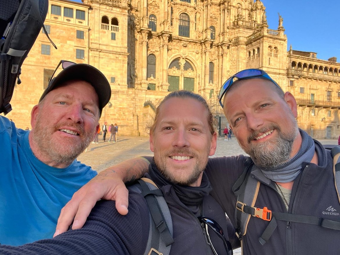Mike, Nicki and Dennis in front of Santiago cathedral in the Praza do Obradoiro