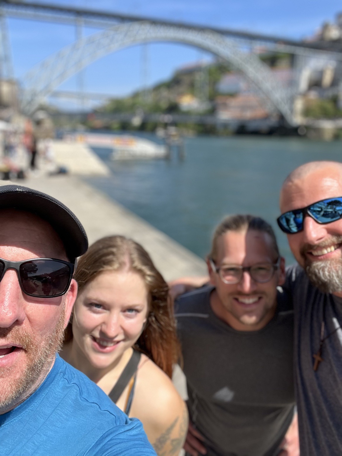 Mike, his daughter Sarah, Nicki and Dennis on the banks of the Douro in Porto, with the river behind them