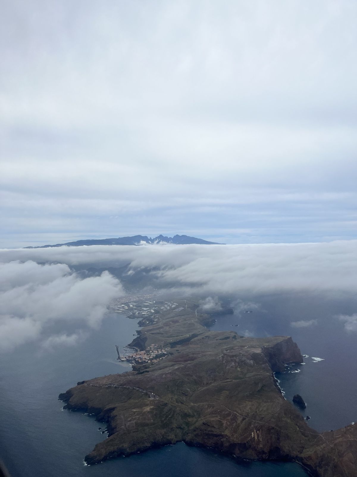 Madeira's eastern peninsula seen from the air, above a sea of cloud