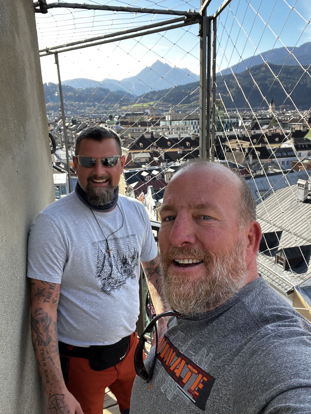 Mike and Nicki on a tower platform overlooking Innsbruck's old town and the Alps