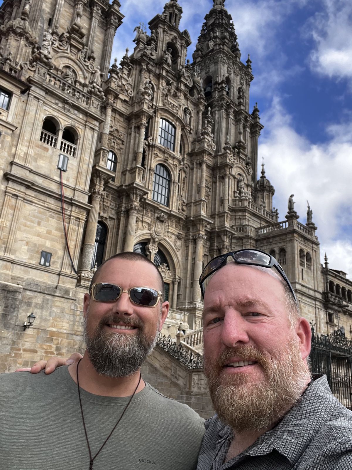 Nicki and Mike selfie in front of the Santiago de Compostela cathedral facade