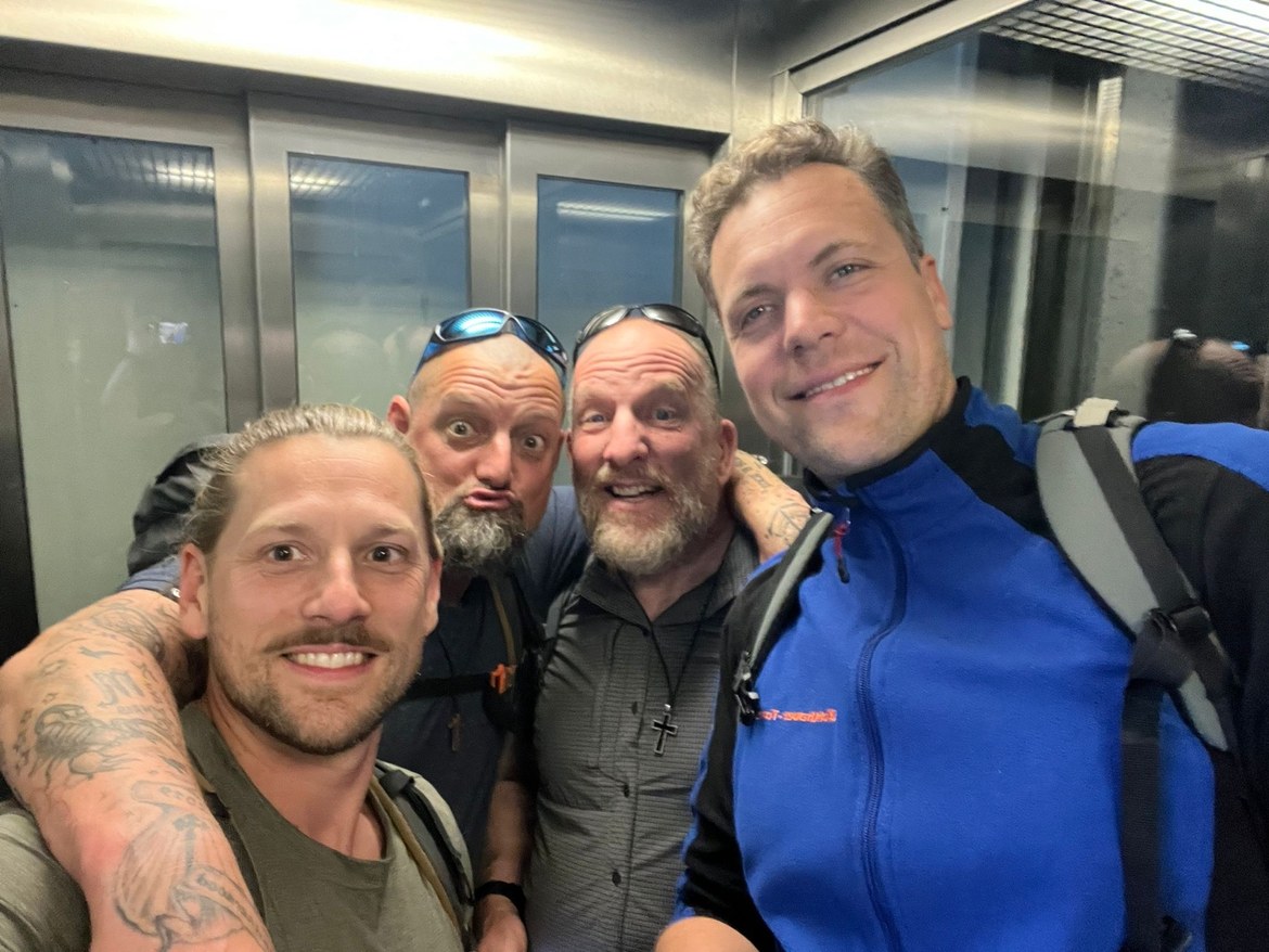 Dennis, Nicki pulling a face, Mike and a friend squeezed into an elevator selfie