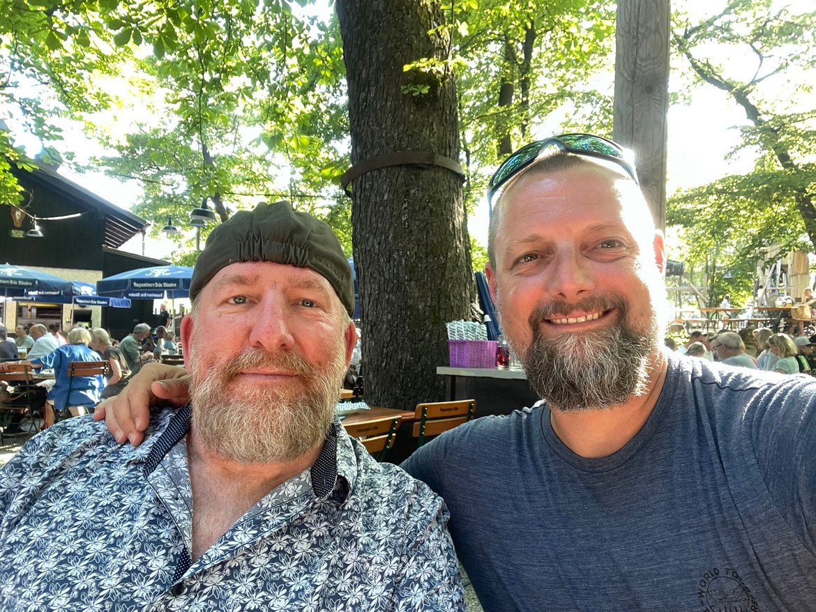 Mike and Nicki taking a selfie in a Munich beer garden under chestnut trees